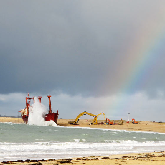 Florence Boudet - FLO-FLO - brittany - rainbow - storm - cargo ship - beached - beach - shore - wave - sea - december - crane - dismantle - impressive - cloud - grey - sun